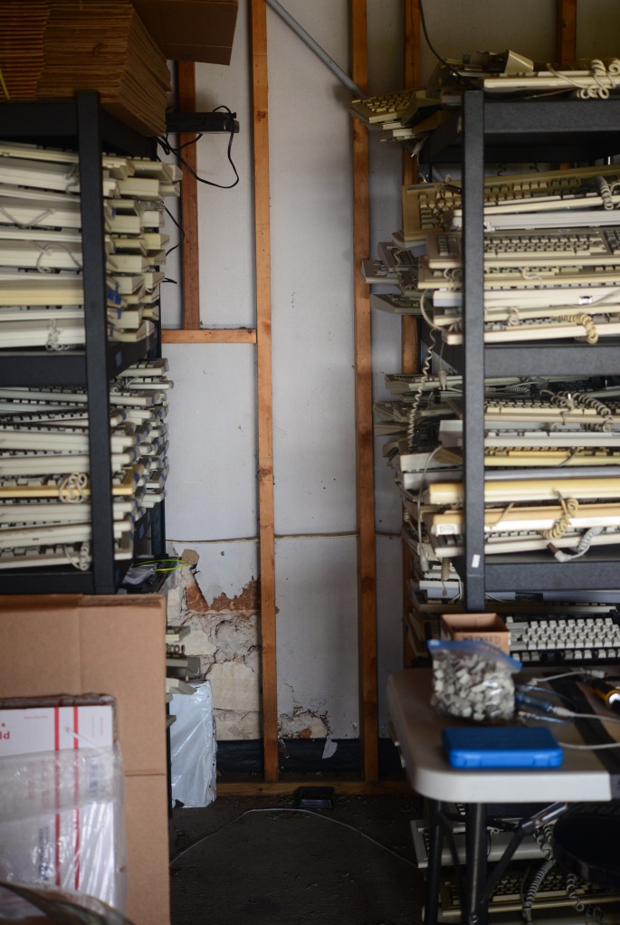 Left aisle. Tandy and Honeywell keyboards are on the upper left. Space Invaders on the middle left shelf. On the right side are a number of Alps and foam-and-foil boards.